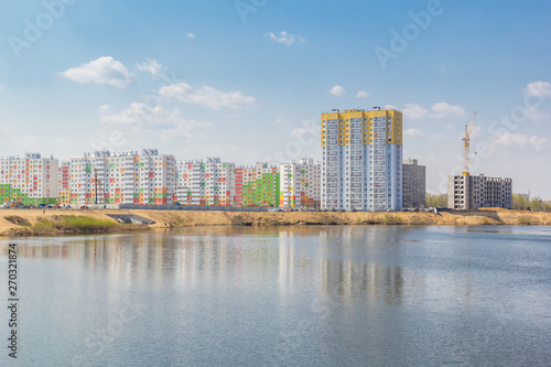 Residential buildings with reflection on the lake