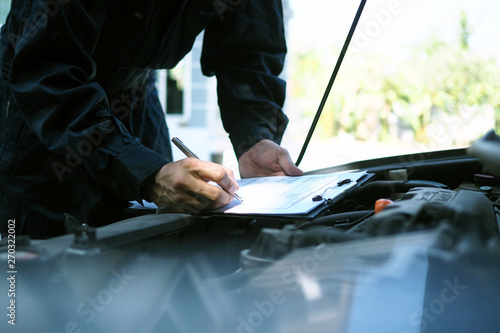 The engine engineer is checking and repairing the car. Off-site care services photo