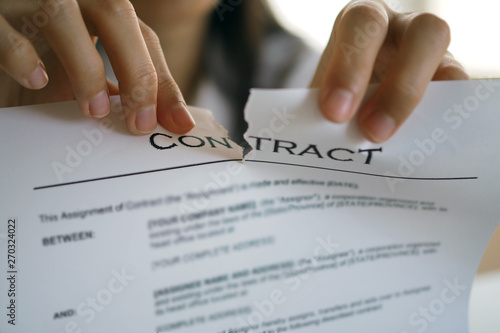 Bilde på lerret Businessmen are tearing documents, contracts or agreements that have direct legal consequences