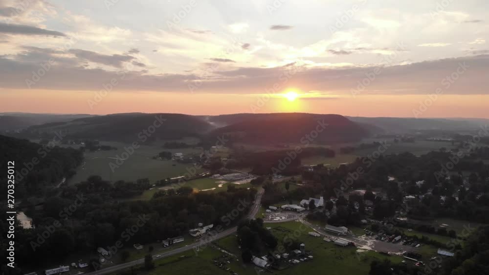 Descending aerial view of the sunset in a town in Maine, United States of America Descending aerial view of the sunset in a town in Maine, United States of America
