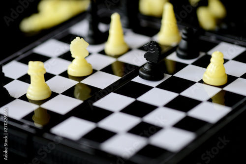 Travel Chess Set on a dark background close up