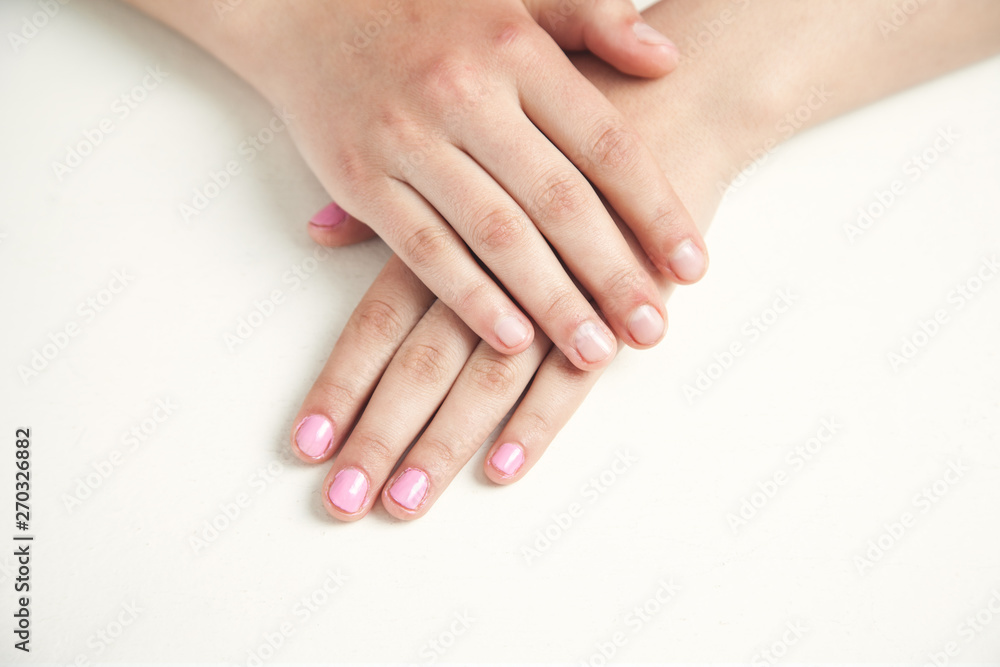 Hands with beautiful manicure in salon. Fashion