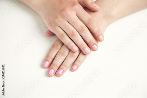 Hands with beautiful manicure in salon. Fashion