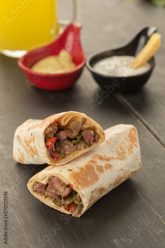 gourmet sliced tortilla roll, burittos, meat wraps with French fries