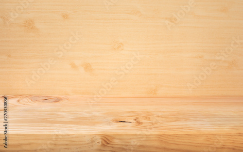 Selective focus.Empty wood table top on wood wall background