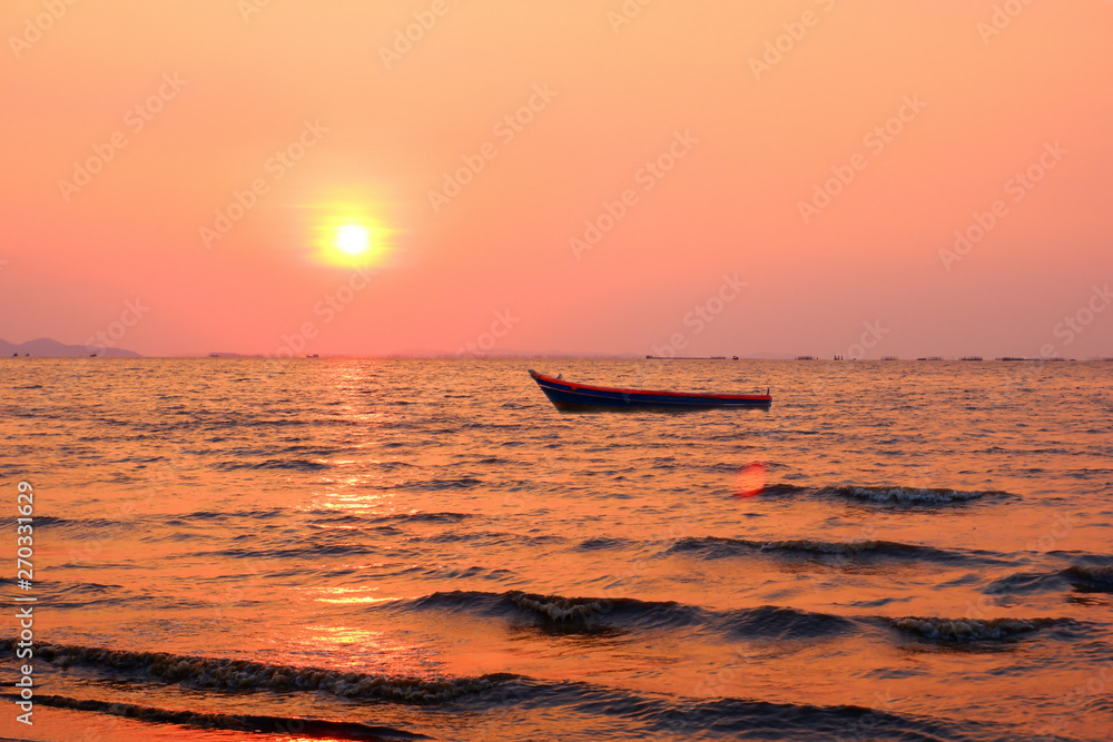 Small fishing boat concept Floating in the sea in the evening