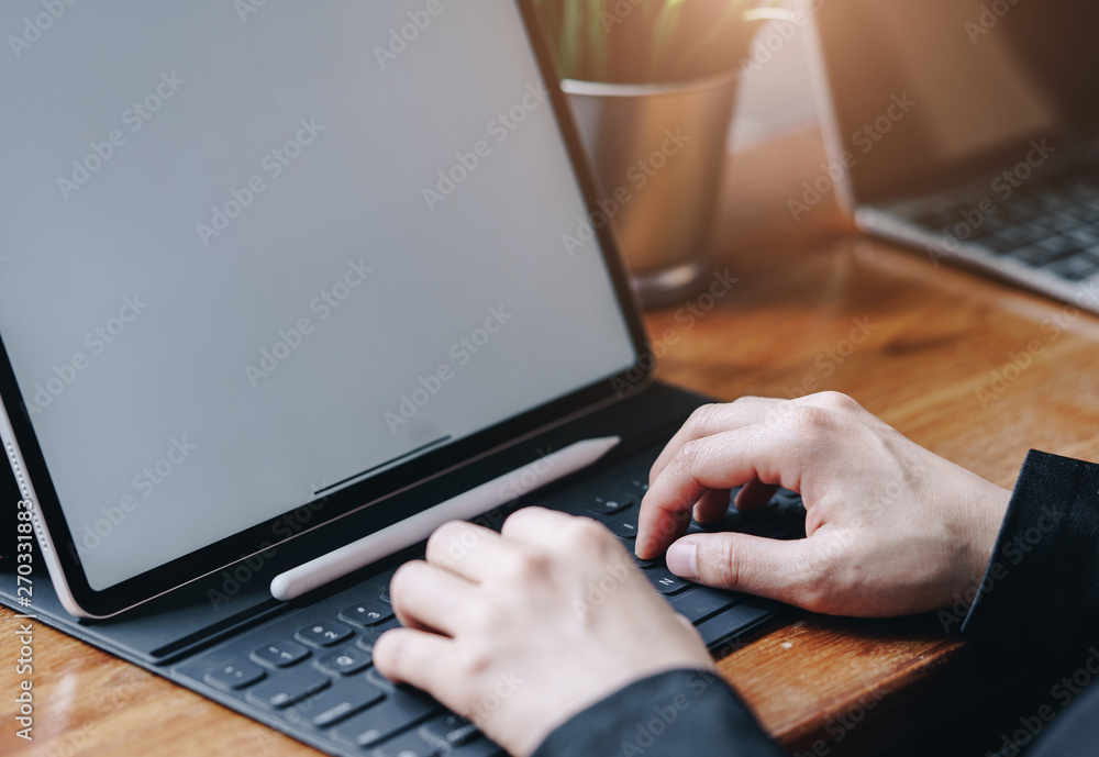 Businesswoman working with keyboard of tablet portable at office. Business technology concept. Businesswoman working with keyboard of tablet portable at office. Business technology concept.