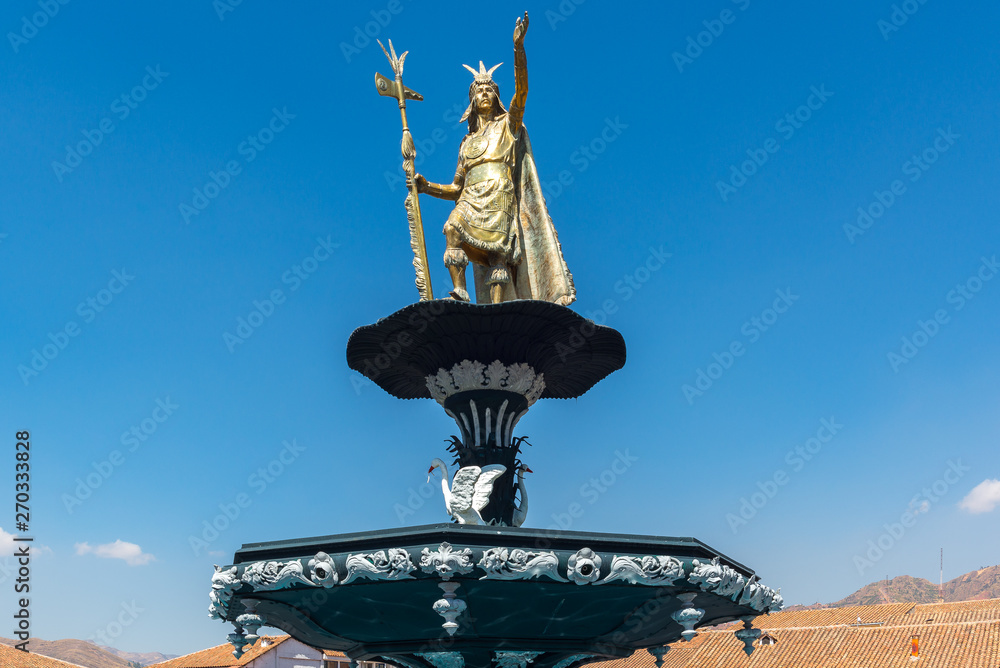 Statue of Inca Pachacutec on top of the fountain of Plaza de Armas, Cuzco, Peru