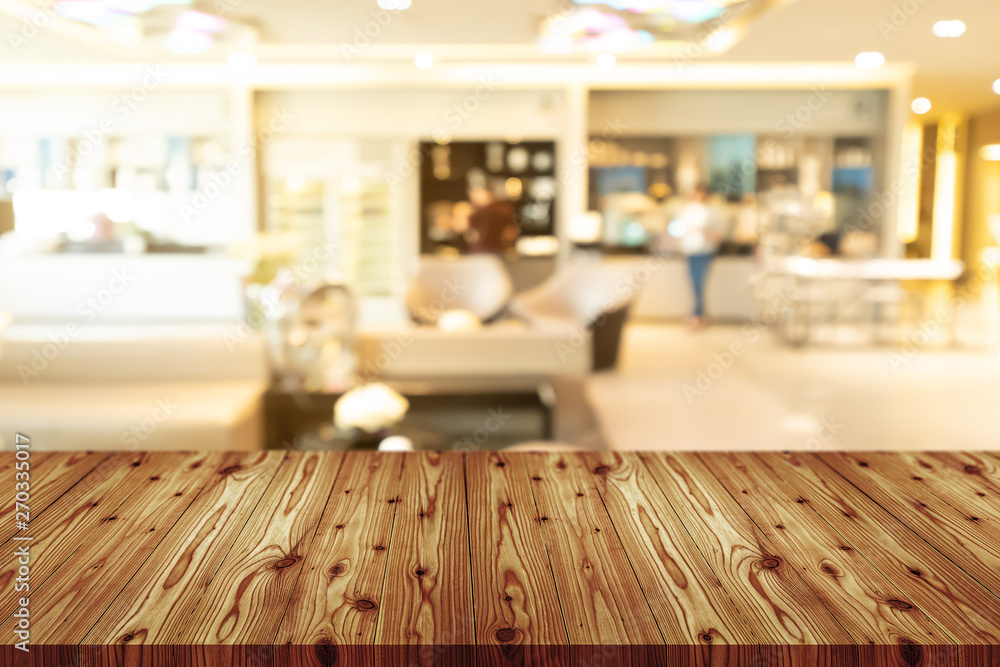 Empty wooden table top with blurred of coffee shop, cafe, bar background, Abstract background can be used for display or montage your products. Empty wooden table top with blurred of coffee shop, cafe, bar background, Abstract background can be used for display or montage your products.