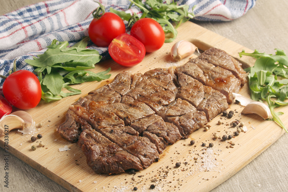 A beef steak well done with vegetables A beef steak well done with vegetables