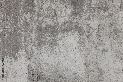 The texture of the old grey concrete wall with scratches, cracks, dust, crevi...