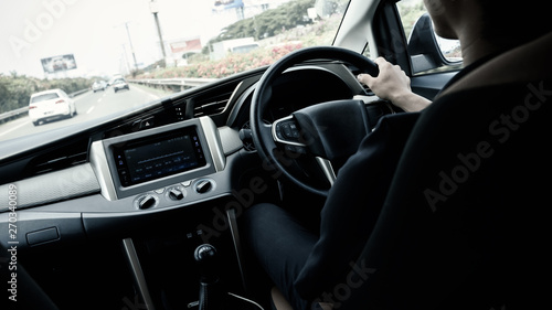 driver keeps driving car on a highway, selective focus © happycreator