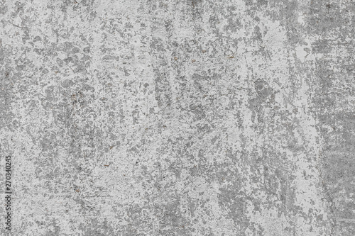 The texture of the old grey concrete wall with scratches, cracks, dust, crevi...