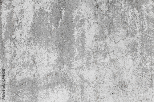 The texture of the old grey concrete wall with scratches, cracks, dust, crevices, roughness, stucco. Can be used as a poster or background for design