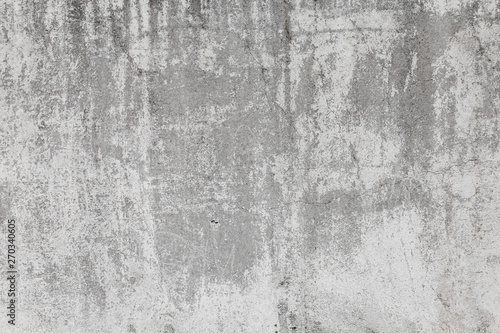The texture of the old grey concrete wall with scratches, cracks, dust, crevi...