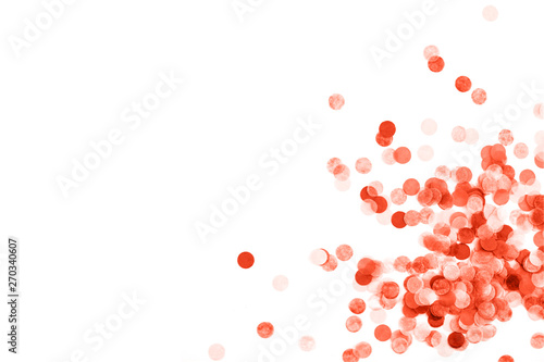 Bright coral confetti isolated on white background.