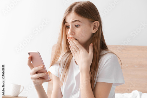 Afraid teenage girl with mo...