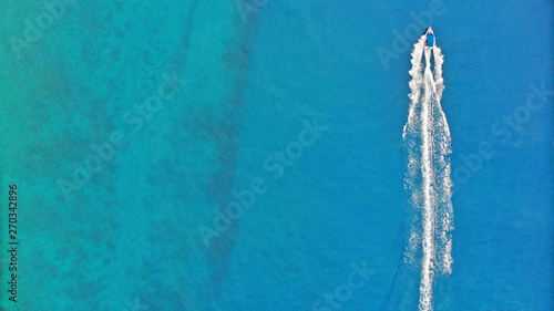 Fotografie Aerial. Speedy boat sailing by sea. Top view, copy space.