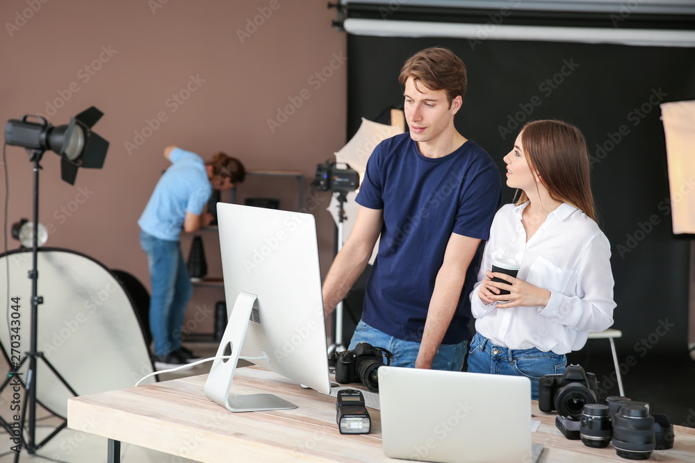 Fototapeta premium Professional photographers working in modern studio