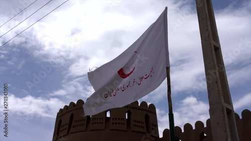 Iranian Flag Flies In Front of Rayen Castle in Slow Motion. photo