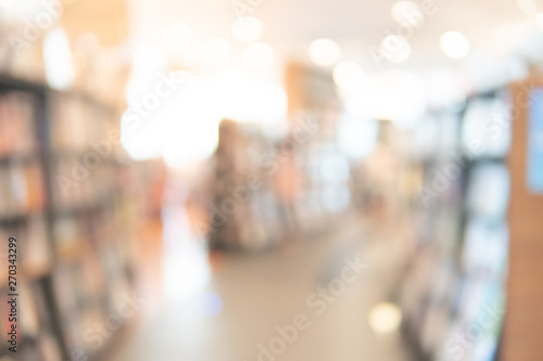 Abstract blur curved bookshelf in bookstore or school library. Blurred bookshop interior for background or backdrop. Education learning or printed media entertainment concepts © zephyr_p