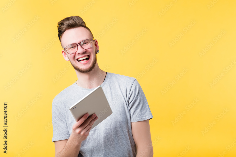 Digital information communication social media networking. Excited young man tablet in hand. Youth lifestyle leisure tools. Digital information communication social media networking. Excited young man tablet in hand. Youth lifestyle leisure tools.