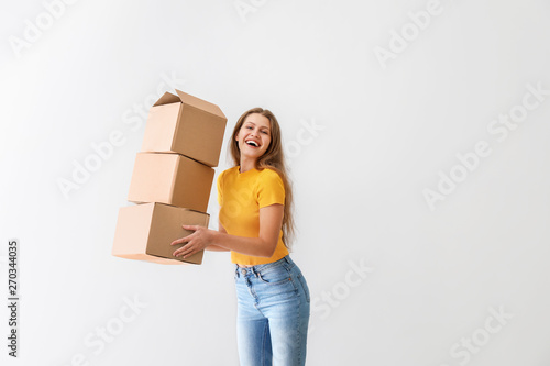 Young woman with cardboard ...