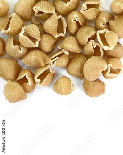 Wholemeal pasta on a white background 