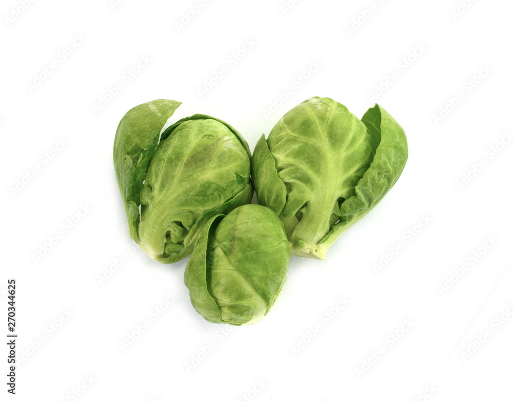a pile of Brussels sprouts on a white background. a pile of Brussels sprouts on a white background.