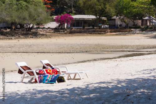 Sun bed on the beach  at Vongdeuan beach sunset in the Koh Samet island, Rayong, Thailand. photo