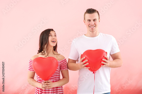 Happy young couple with air...