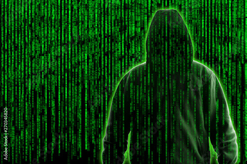 Conceptual image of a hacker on green programming code background