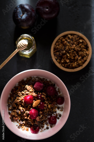 Breakfast with granola, cherry and honey.healthy breakfast Proper nutrition.