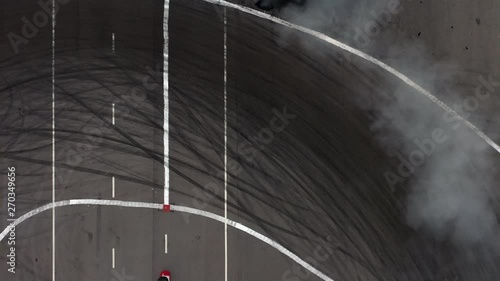 Wallpaper Mural 4K, Two car drift battle with smoke, Aerial top view of two car drifting on the race track. Torontodigital.ca