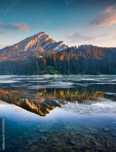 Fototapeta Naklejka Na Ścianę i Meble -  Beautiful morning view of the Obersee lake. Colorful summer sinrise in the Swiss Alps, Nafels village location, Switzerland, Europe. Beauty of nature concept background.