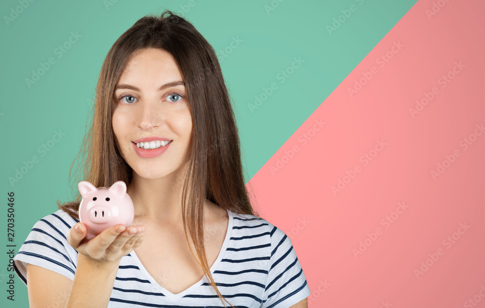 young woman 20s in casual clothing holding piggybank with lots of money isolated young woman 20s in casual clothing holding piggybank with lots of money isolated