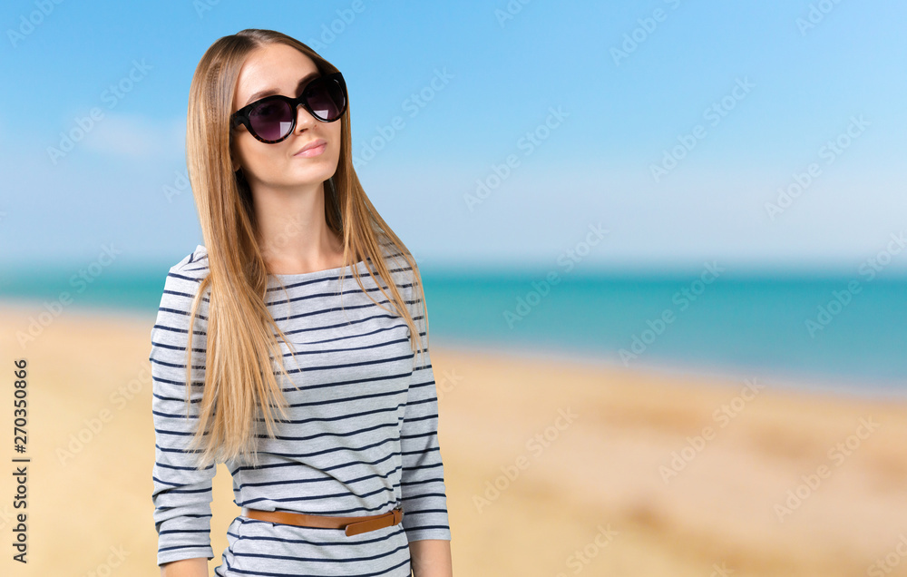 Smiling woman traveler against resort blurred background Smiling woman traveler against resort blurred background