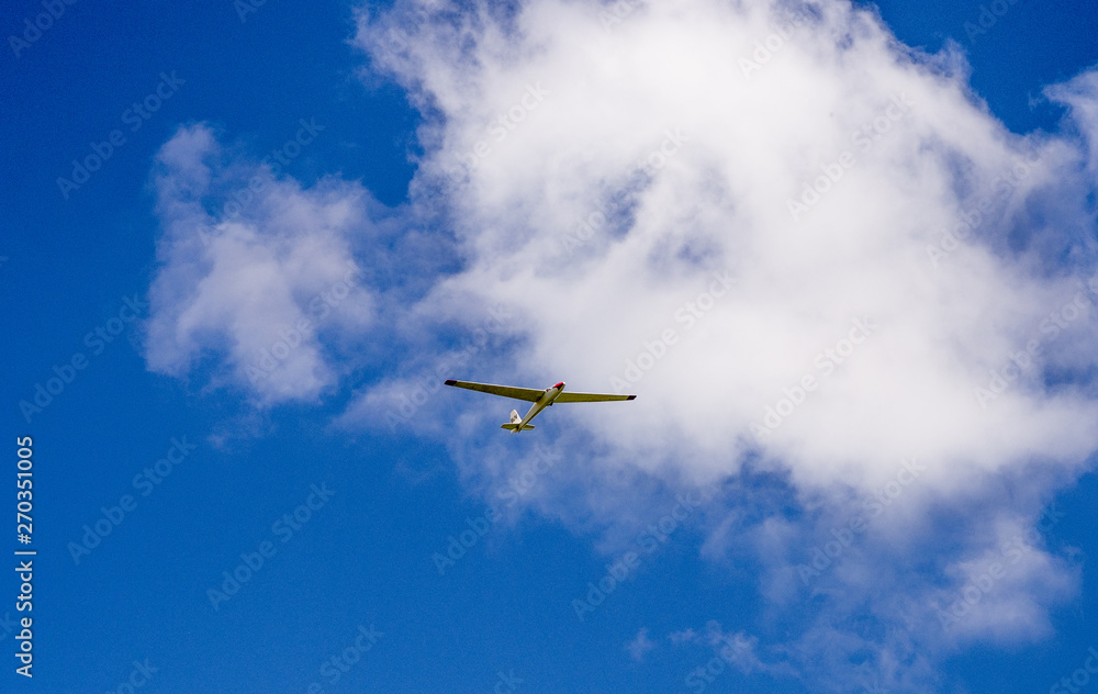 Glider plane riding the thermals high above Latriff Fell, Keswick, Cumbria, UK