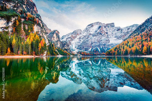 First snow on Braies Lake. Colorful autumn landscape in Italian Alps, Naturpark Fanes-Sennes-Prags, Dolomite, Italy, Europe. Beauty of nature concept background.