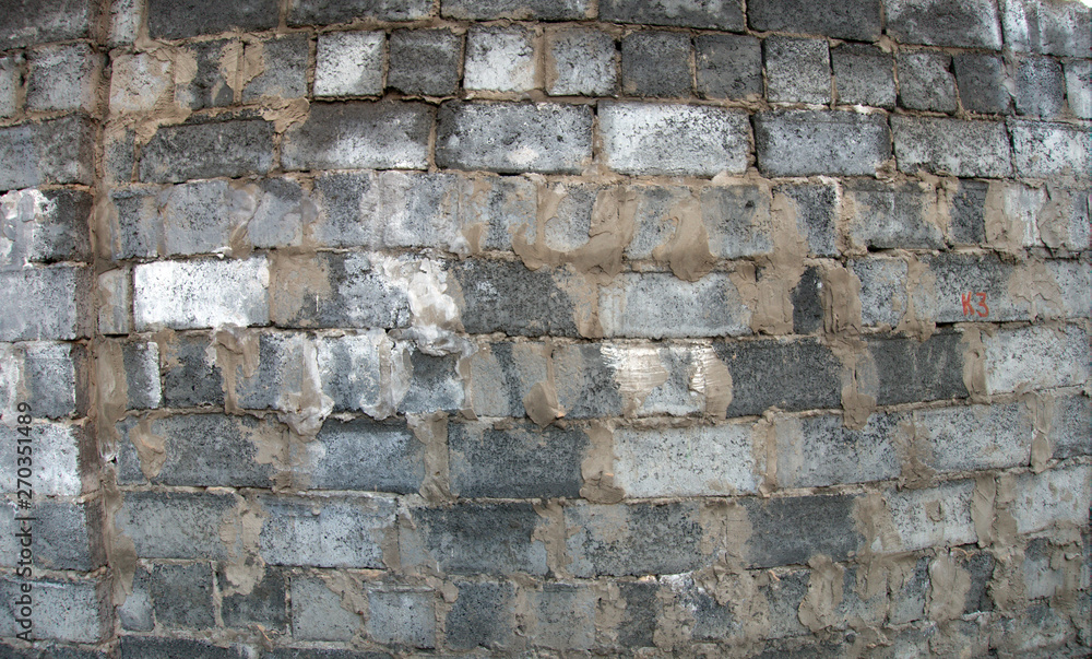 Fototapeta premium Stone and brick wall background with concrete elements