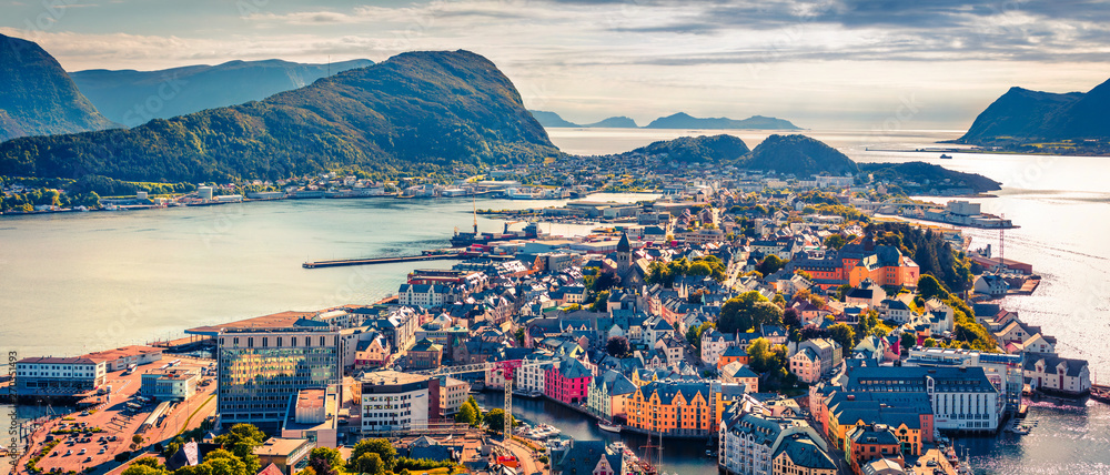 From the bird's eye view of Alesund port town on the west coast of Norway, at the entrance to the Geirangerfjord. Colorful morning scene of the Nord. Traveling concept background.