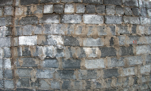 Stone and brick wall background with concrete elements