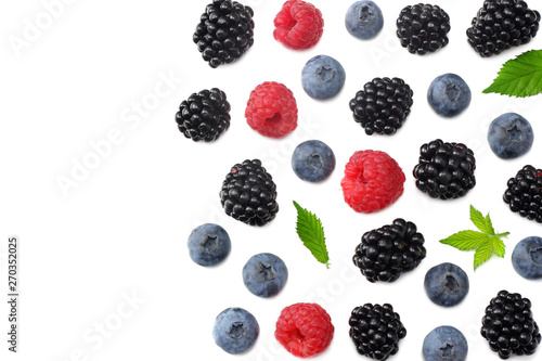 mix of blueberries, blackberries, raspberries isolated on white background. top view with copy space