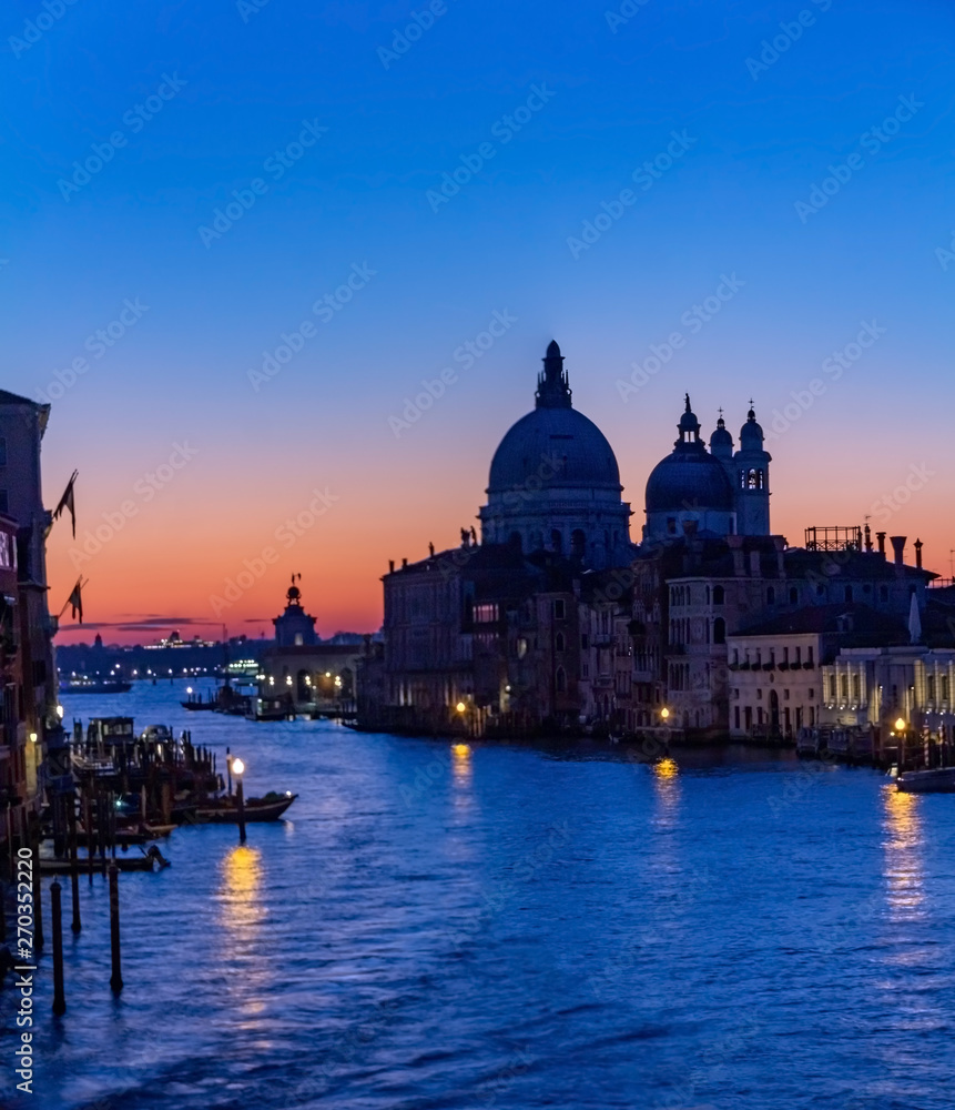 Venice is a beautiful and fascinating sunrise on the Grand Canal near the Basilica of Santa Maria della Salute, Venice. Romance, travel concept