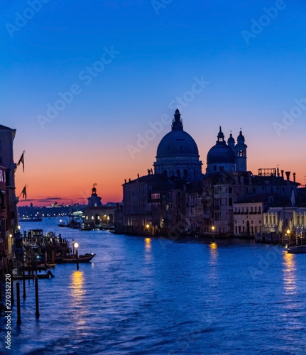 Venice is a beautiful and fascinating sunrise on the Grand Canal near the Basilica of Santa Maria della Salute, Venice. Romance, travel concept © Volodymyr