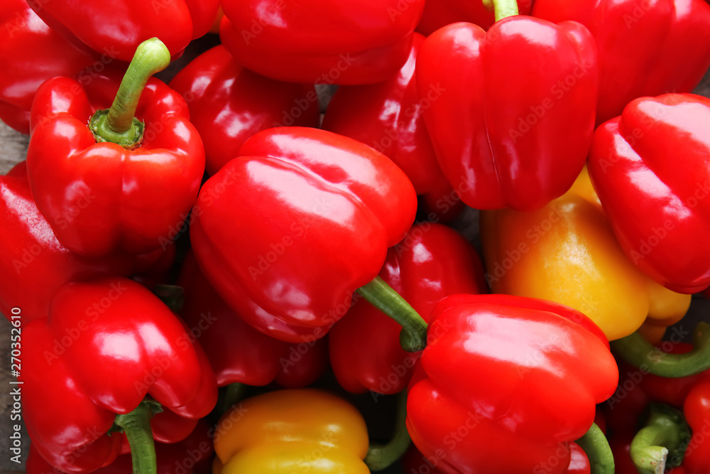 Many ripe peppers as background