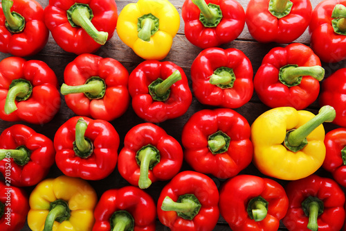 Many ripe peppers as background