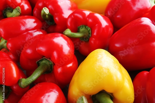 Many ripe peppers as background