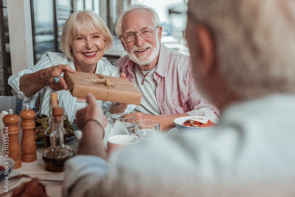 Obraz premium Happy mature loving couple celebrating birthday party