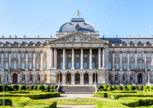 Front view of the colonnade and formal garden of the Royal Palace of Brussels, the official palace of the King and Queen of the Belgians in the historic center of Brussels, Belgium, on a sunny day.